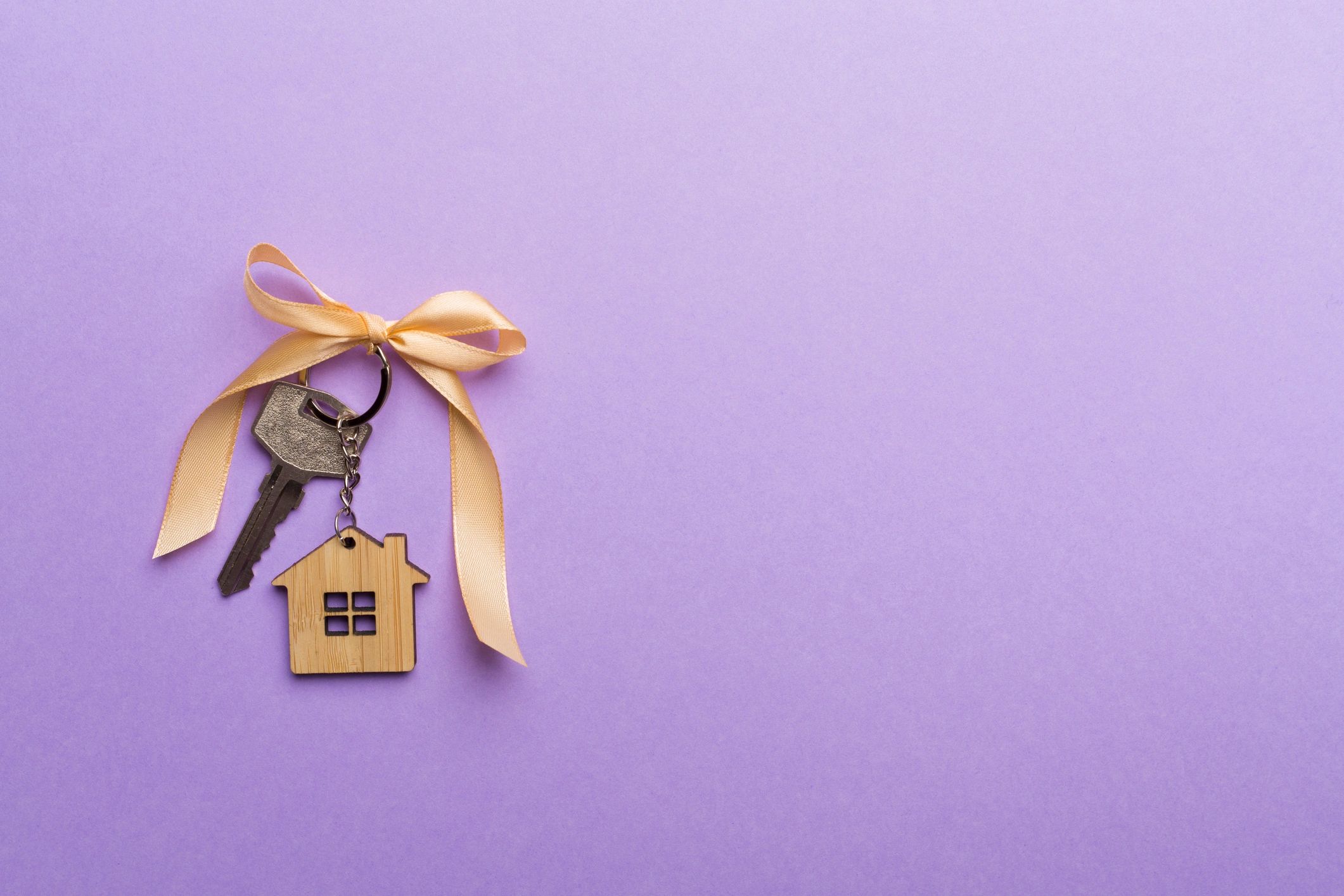 House key with a golden bow
