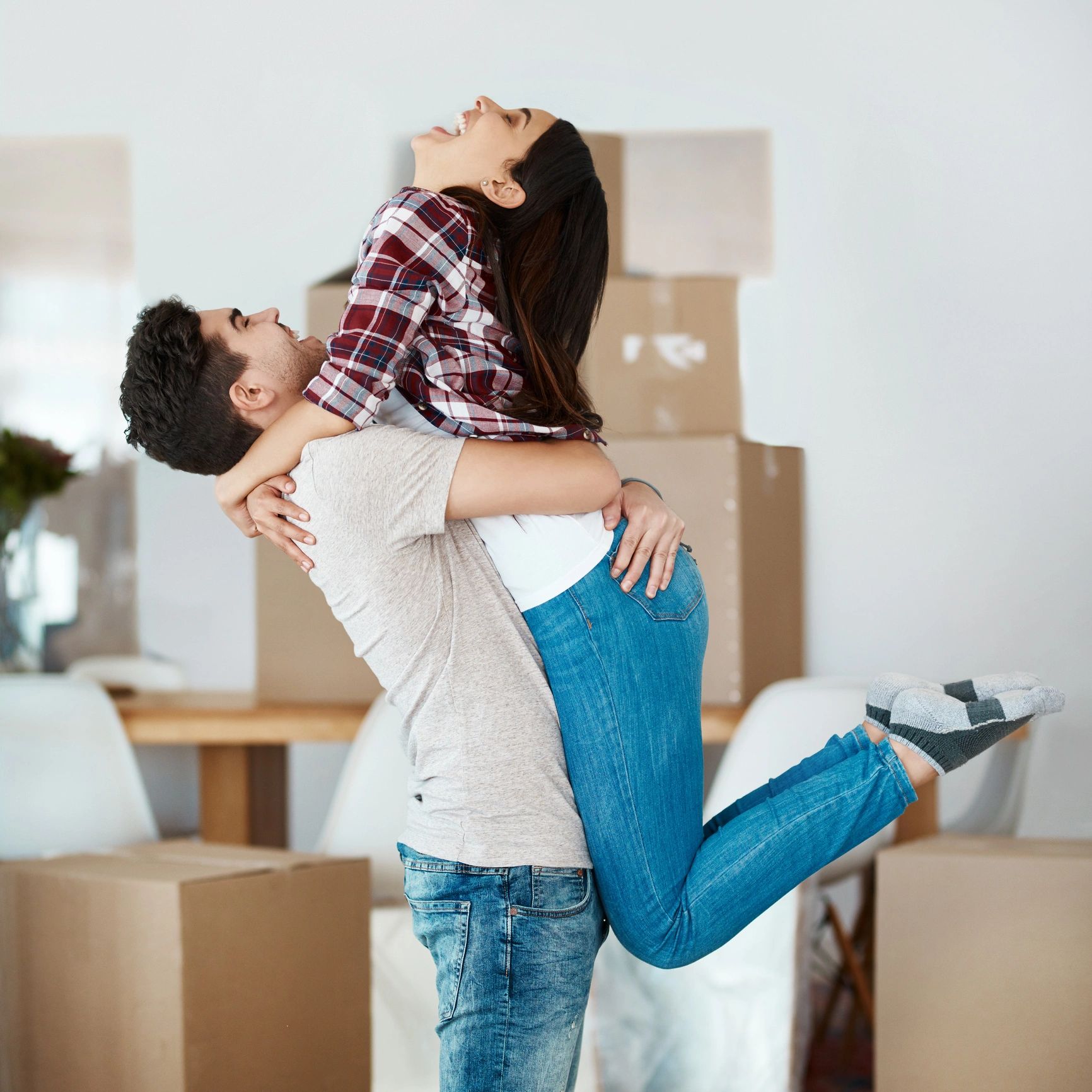 Happy couple moving into a new home